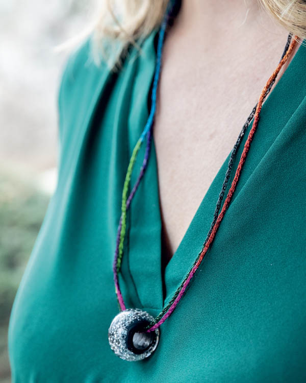 A woman wearing a freya chain wire necklace