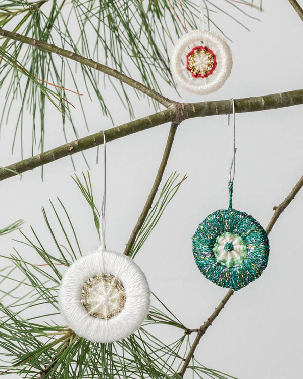 Several crosswheel ornaments on a Christmas tree