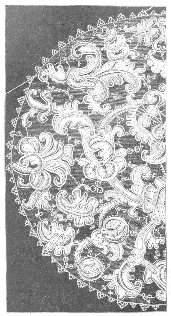 Half circle of lace with heavy foliage motifs