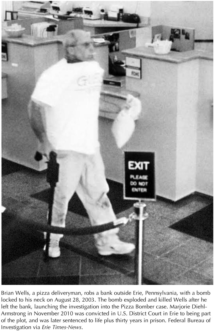 Brian Wells, a pizza deliveryman, robs a bank outside Erie, Pennsylvania, with a bomb locked to his neck on August 28, 2003. The bomb exploded and killed Wells after he left the bank, launching the investigation into the Pizza Bomber case. Marjorie Diehl-Armstrong in November 2010 was convicted in U.S. District Court in Erie to being part of the plot, and was later sentenced to life plus thirty years in prison. Federal Bureau of Investigation via Erie Times-News.