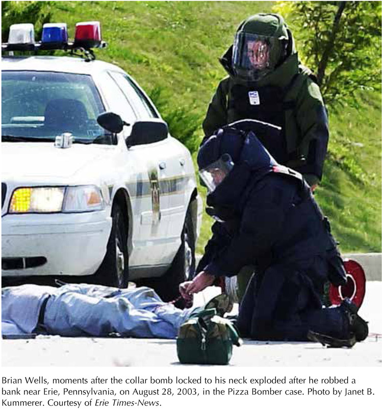 Brian Wells, moments after the collar bomb locked to his neck exploded after he robbed a bank near Erie, Pennsylvania, on August 28, 2003, in the Pizza Bomber case. Photo by Janet B. Kummerer. Courtesy of Erie Times-News.