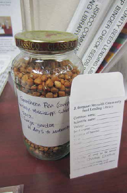 Jar with bulk seed and envelope for patron to fill.