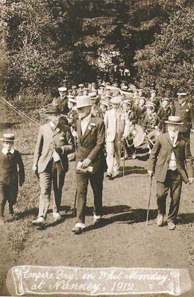 Fig. 82. Artistic dandy: Robert leading the Empire Day Parade at Nunney in pale bowler hat and spats, 1912.