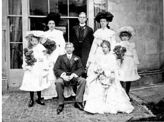 Fig. 105. Henry and Rose Parry-Okeden on their wedding day at Turnworth House, November 1902, with Hope Burke and Violet Parry-Okeden as chief bridesmaids.