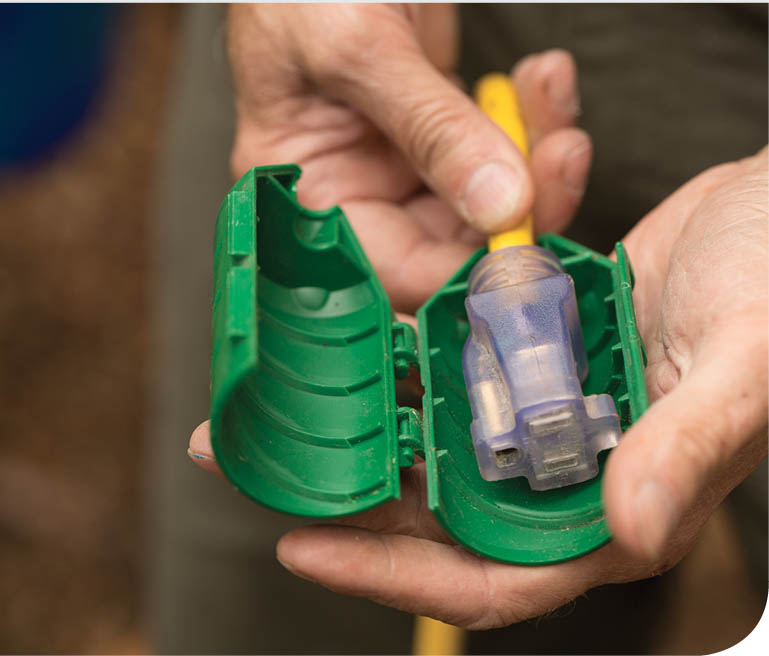 An extension cord with a plastic case.