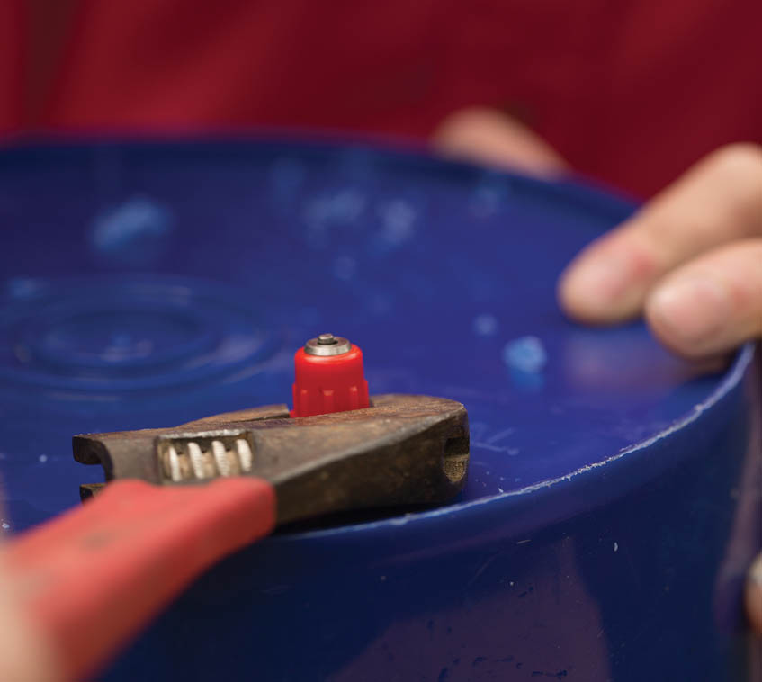 Screwing the nipples into the bucket.