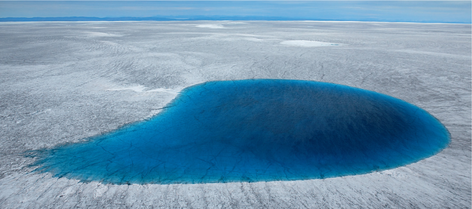 The water from Greenland’s sapphire lakes eventually cascades down cracks and gaping holes to the rocks below the glacier. It then gushes out at the edge of the ice. Less water emerges than expected, so scientists speculate that there are also sub-glacial lakes under the ice as well. Water at the base of glaciers helps lubricate their movements, so they are now looking at how these lakes are going to have an impact on ice melt in a warming world.