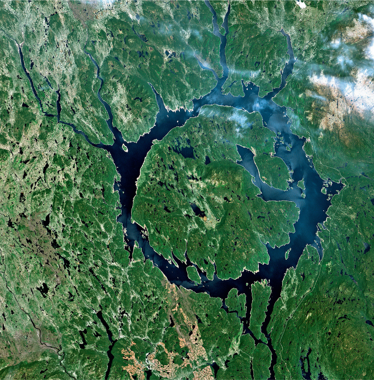 Lake Manicouagan in central Quebec takes the shape of an unbroken ring in the basin of a massive impact crater formed over 200 million years ago. The multi-ringed crater is 100 kilometres in diameter, and the lake 70 kilometres across © NASA GSFC Landsat/LDCM EPO Team.