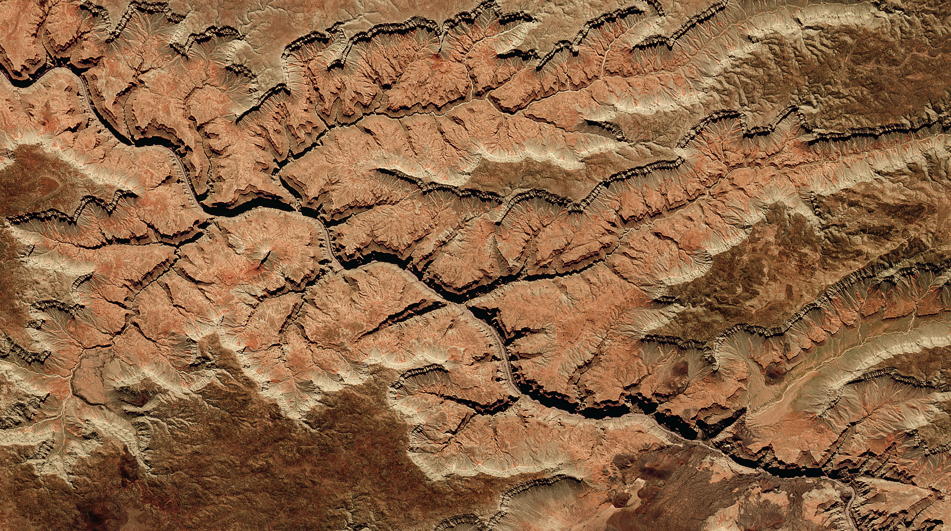 This satellite view of the Grand Canyon shows where the Colorado River has sliced down through the rocks of the Colorado Plateau, representing almost two billion years of prehistory. The age of the canyon itself is the subject of scientific controversy. Some say it is about 6 million years old, while others claim it to be 70 million years old, but, whoever is right, it doesn’t detract from the fact that the erosion of the canyon has exposed one of the most complete columns showing Earth’s geological history. © 2018, Deimos Imaging SLU, an UrtheCast Company.