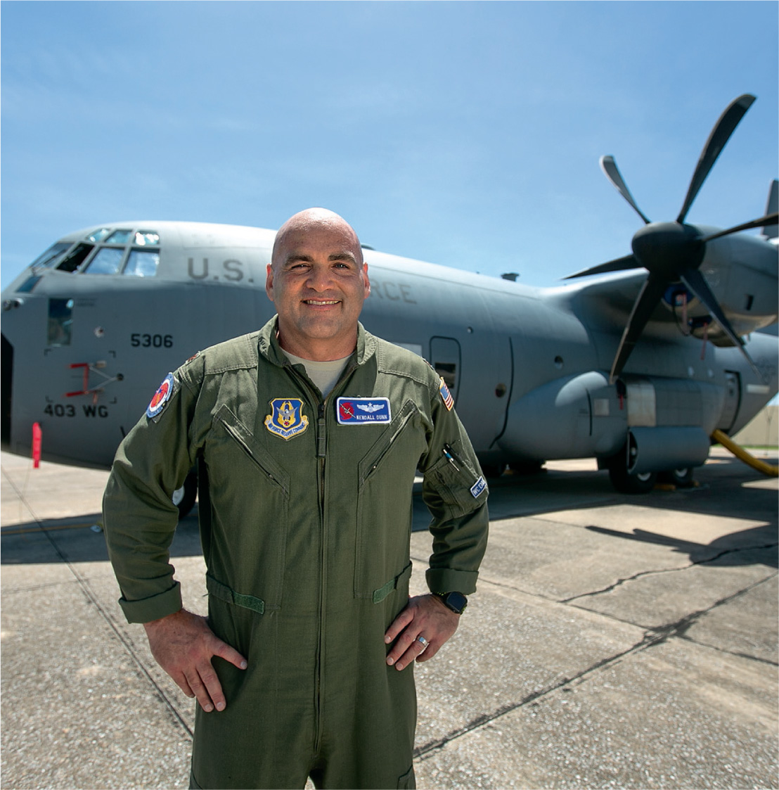 Major Kendall Dunn with his Lockheed WC-130 aircraft, which is flown into tropical storms and hurricanes. Satellites cannot record barometric pressure or wind speeds within a storm. The Hurricane Hunters can.