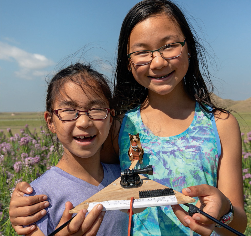 Rebecca and Kimberley Yeung are with their tiny model Amelia Earhart, who will fly to the edge of space.