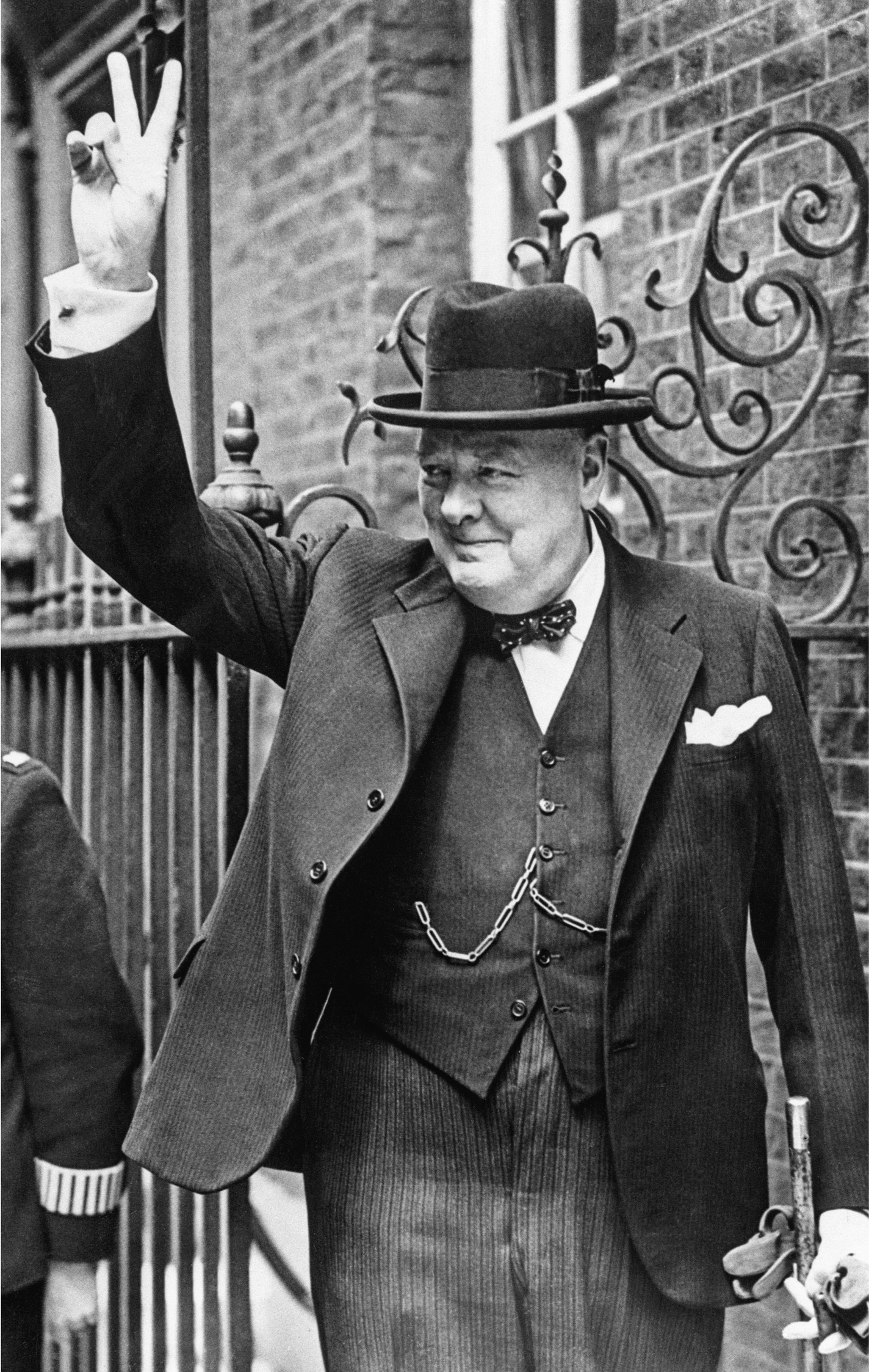 June 1943, London, England, UK --- Prime Minister Winston Churchill makes the victory sign upon returning from a trip to Washington, DC and North Africa. --- Image by © Bettmann/CORBIS