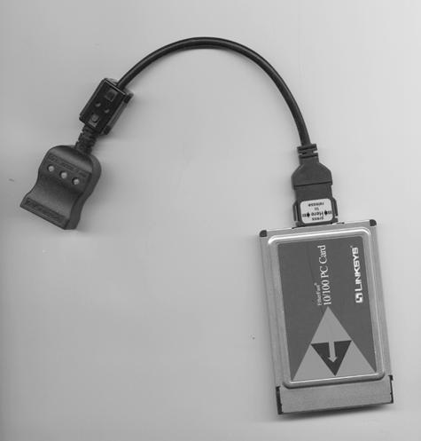 This 16-bit PC card network adapter uses a short cable (sometimes called a dongle) to connect the adapter to an Ethernet socket.