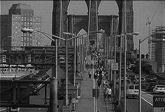 A traffic webcam uses a networked camera. This one shows cars and pedestrians on the Brooklyn Bridge.