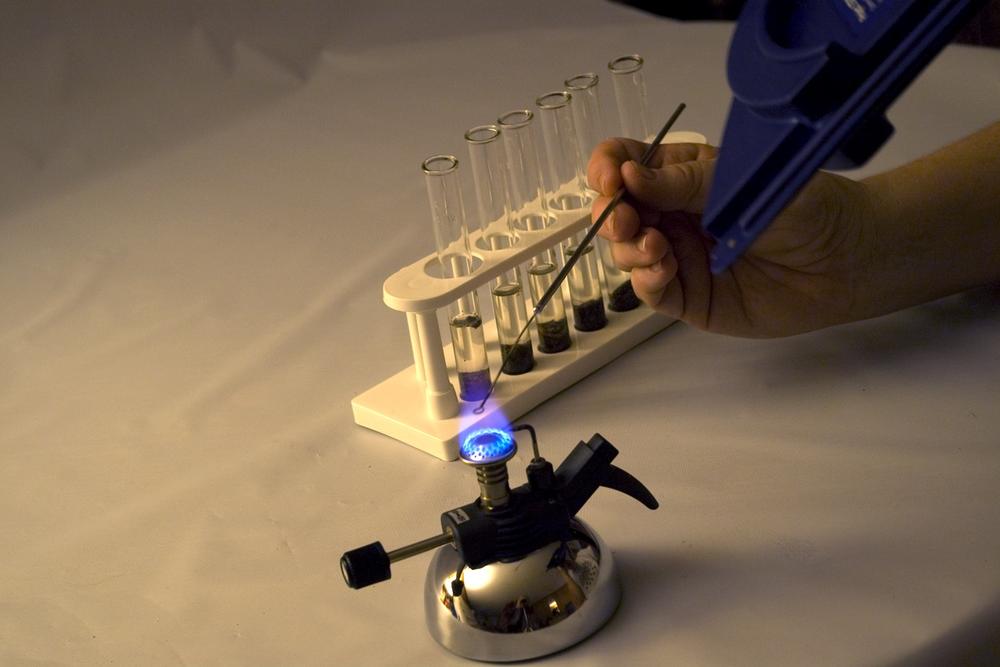 Barbara using the Project Star spectrometer to view emission spectra of soil specimens