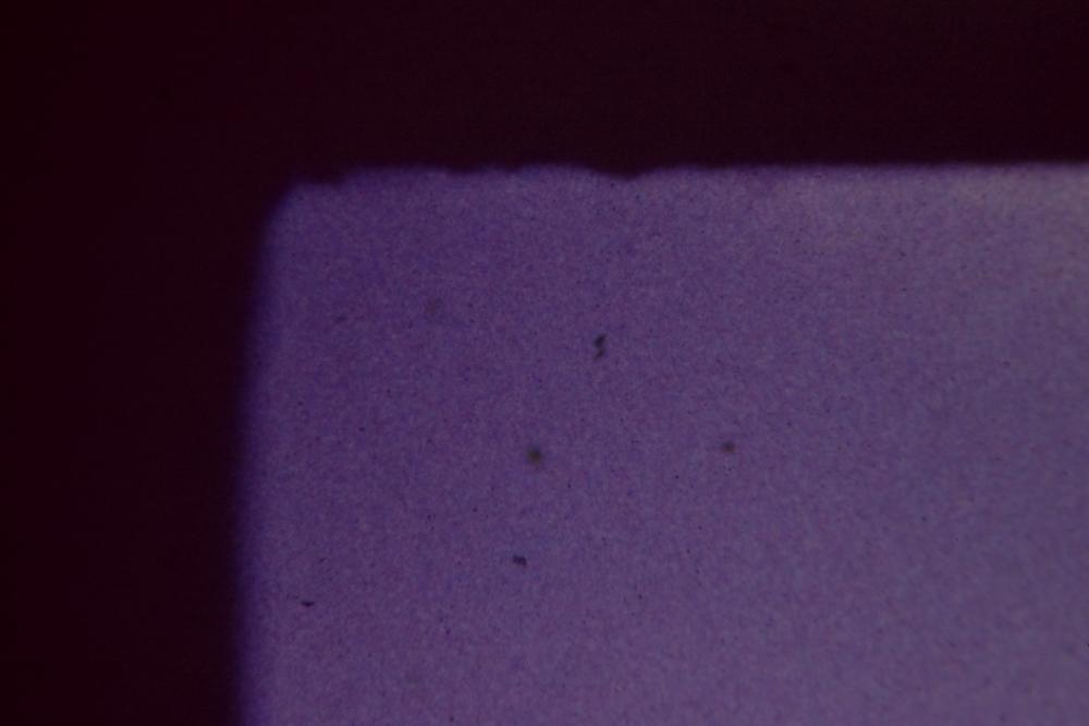 Color slide film at 40X showing individualizable mask roughness on the top left edge