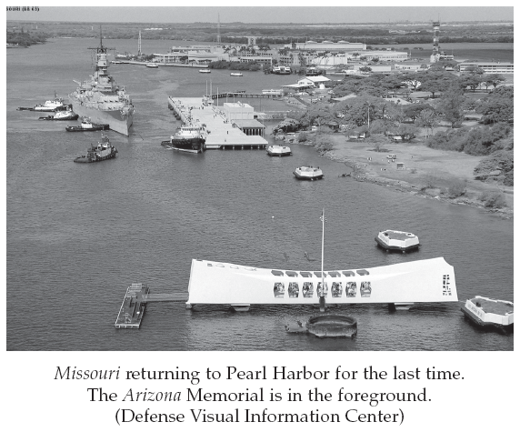 Image: Missouri returning to Pearl Harbor for the last time. The Arizona Memorial is in the foreground. (Defense Visual Information Center)