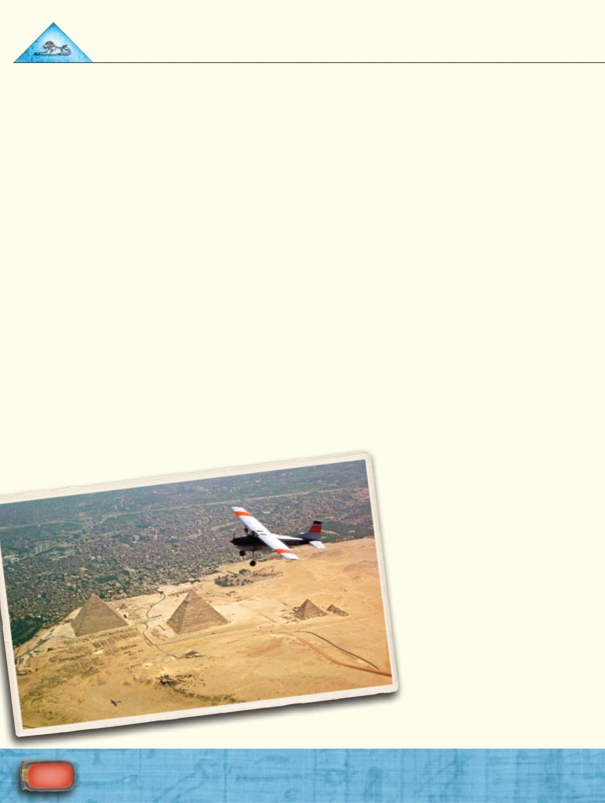 A photo of a plane flying over the Egyptian pyramids.