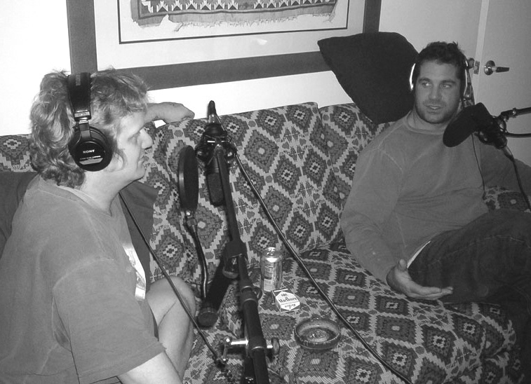 Storytelling at its most basic, but with some recording gear added. Photo of Michael W. Dean and Mike Kelley podcasting, taken by Debra Jean Dean.