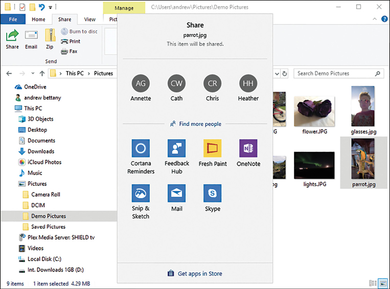 A screenshot shows the file explorer with the Demo Pictures folder selected and a photograph of a parrot selected. The Share context menu is shown in the foreground with a list of four users at the top: Annette, Cath, Chris, and Heather. Below, the following app icons are shown: Cortana, Feedback Hub, Fresh Paint, OneNote, Snip & Sketch, Mail, and Skype.