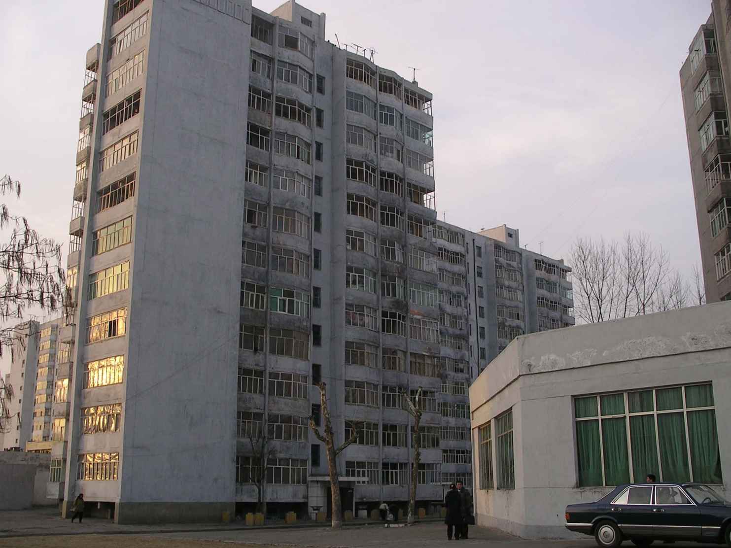 Photograph: Typical ramshackle flats in Pyongyang. In 2006, when this photograph was taken, many had polyethylene in their windows rather than glass.