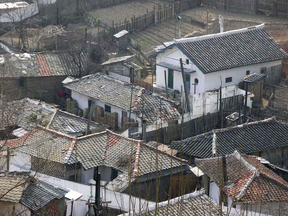 Photograph: Close-up of poor homes around Pyongyang.