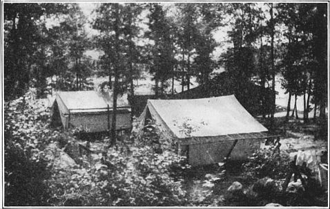 "A Slack Rag of Canvas 'Twixt You and the Stars." Shipshape tents secure from wind, set up with stakes.