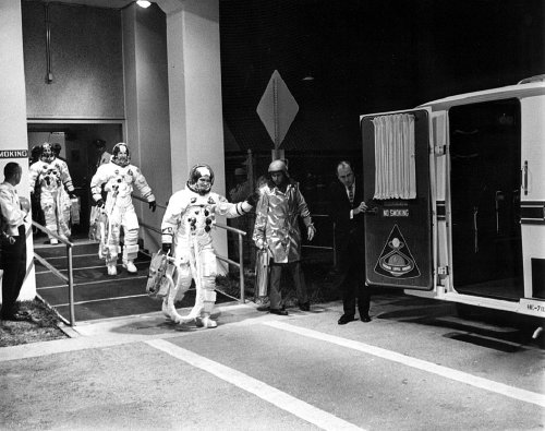 Anders, Lovell, Borman walk out to the crew transfer van for the drive to the pad