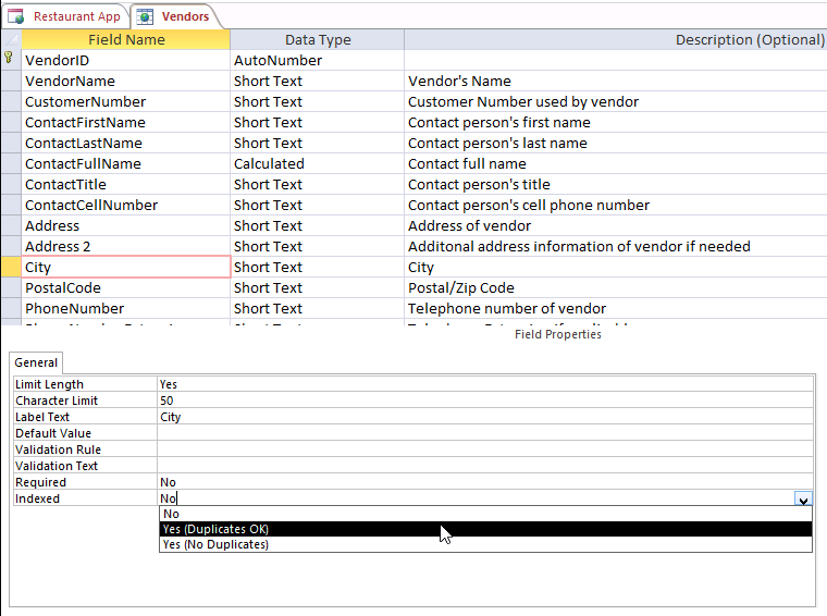 A screen shot of the Vendors table open in Design view. The City field is currently highlighted in the grid. The Author has clicked the Indexed property in the bottom portion where field properties are displayed. The Indexed property displays three options: No, Yes (Duplicates OK), and Yes (No Duplicates).