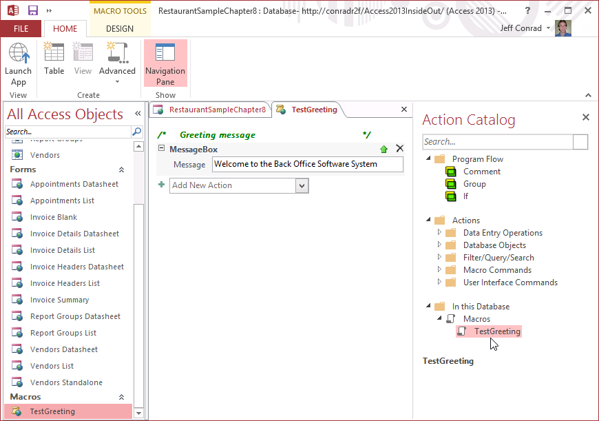 A screen shot of the Access application window. The Navigation pane is expanded, and a new macro object called TestGreeting is listed.
