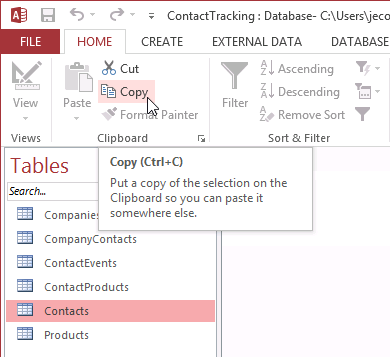 A screen shot of the ribbon and Navigation pane. The Contacts table is highlighted in the Navigation pane, and Author has clicked the Copy command on the ribbon.