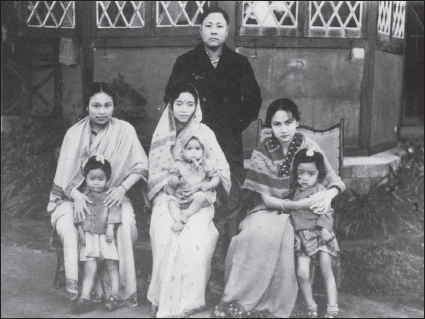 The author at Redlands In Shillong in the household of Konthoujam Paramananda whom she called uncle during her student days. Paramananda (standing, rear) and from the left: Sougaijam Sorojini, Uncle Paramananda’s wife Aunt Subhashini, the writer, and the children of Paramananda.