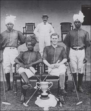 Maharaja Churachand in polo costume (left), F.X. Blackie (right) and players. Standing at left: Subedar Major Haobam Pitamber, who was also a Durbar Member; right, Thingom Amuyaima.