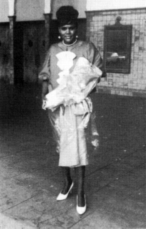 A photo of Dolores Roberts standing inside a building.