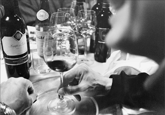 Bottles and glasses of wine on a dinner table