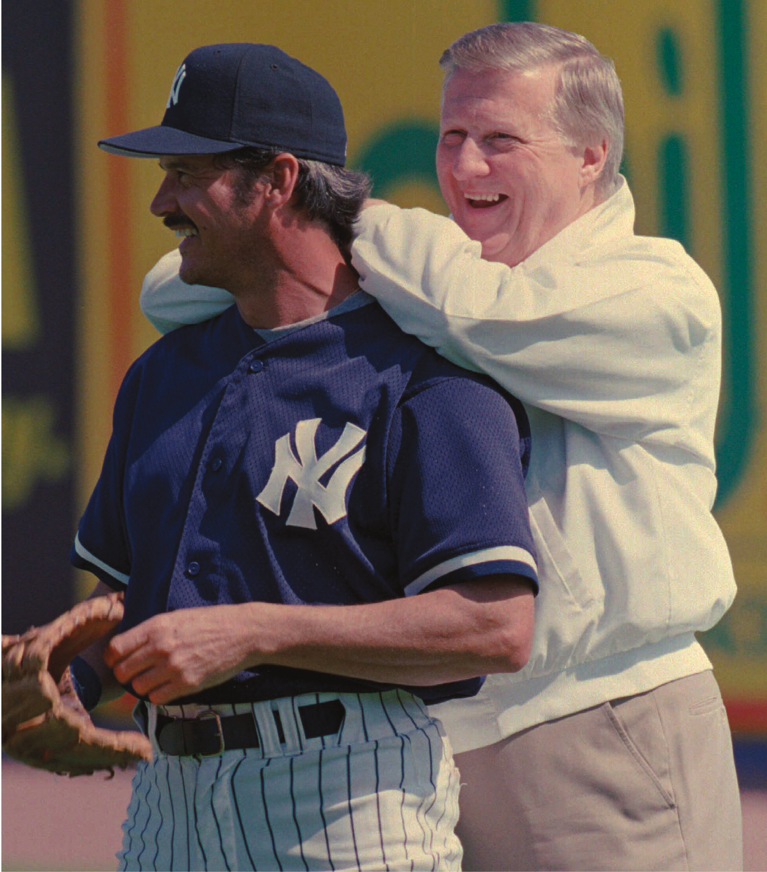 New York Yankees owner George Steinbrenner leans on the back of former Yankees' pitcher Ron Guidry during batting practice Friday, Feb. 23, 1996 at spring training camp in Tampa, Fla.(AP Photo/rusty kennedy)