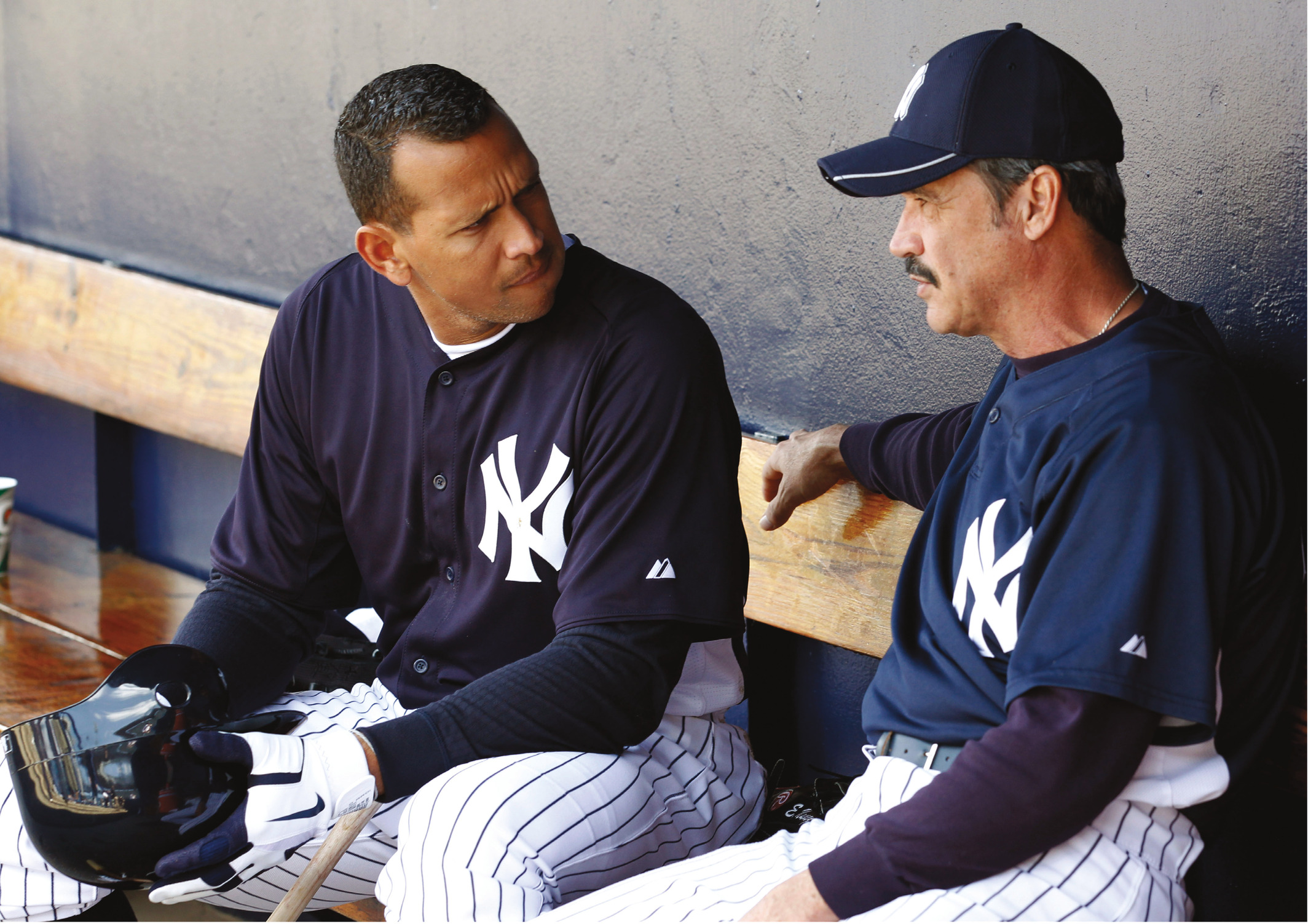 New York Yankees' Alex Rodriguez, left, talks with coach Ron Guidry during the team's first full-squad spring training baseball practice Sunday, Feb. 20, 2011, in Tampa, Fla. (AP Photo/Mike Carlson)