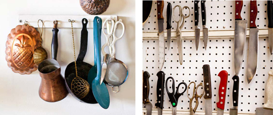 tools hanging from wall rack; knives on magnetic strips