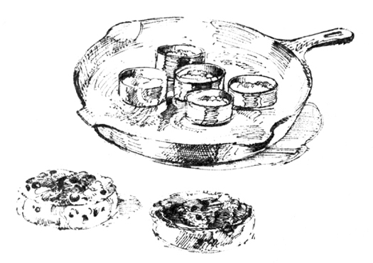 Sketches: Crumpets frying on a skillet in buttered metal rings; two finished biscuits