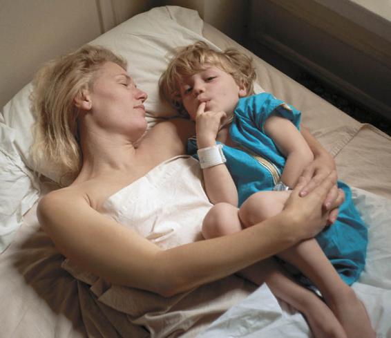 Photo of mother and toddler sharing a bed.