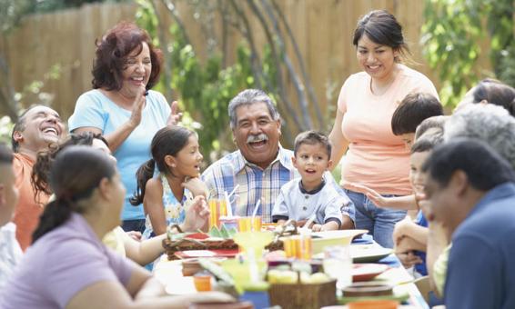 Photo of a happy family party where everyone is smiling or laughing.