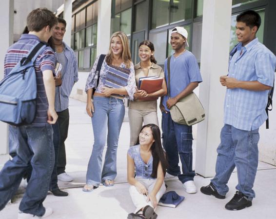 Photo of a group of young men and women, laughing and maybe flirting with each other.