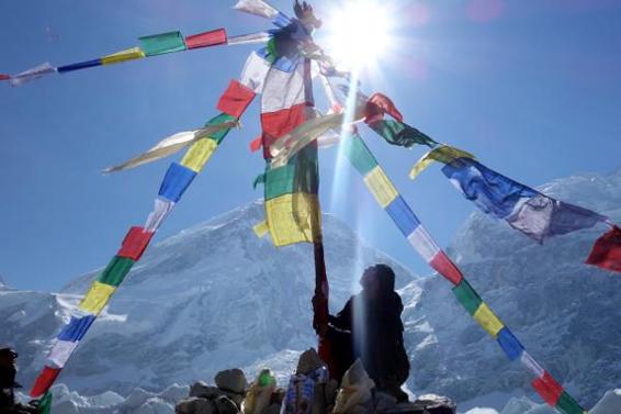 Raising the prayer flags, with the West Shoulder behind