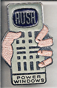 A Power Windows pin of a handcontrol and a hand holding it.