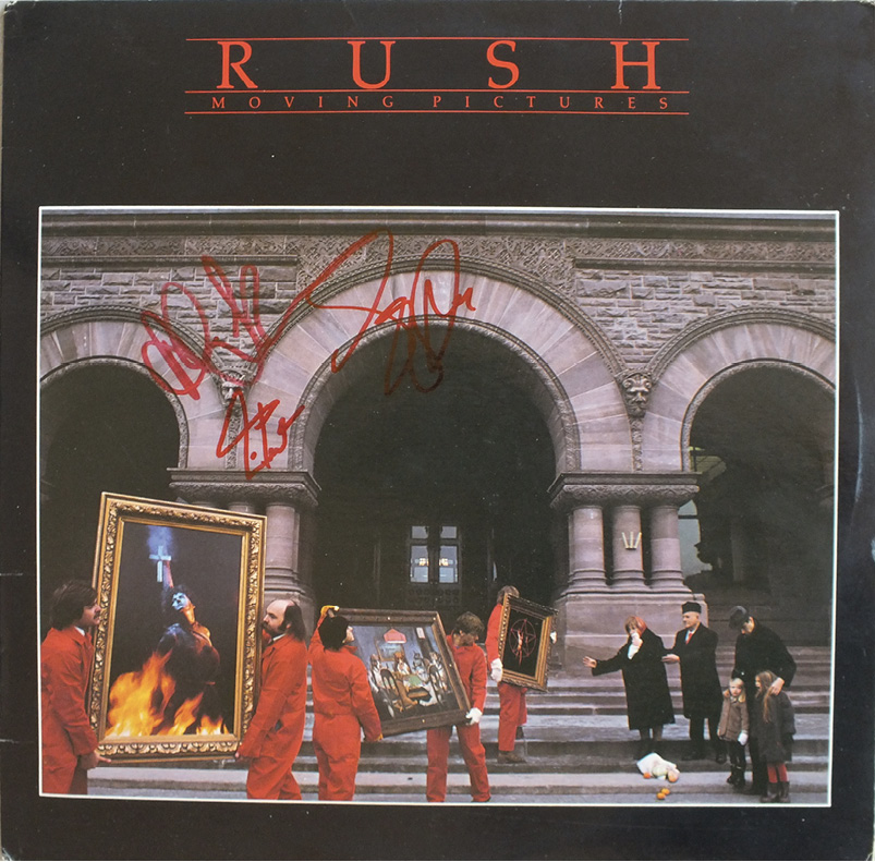 The album cover of Moving Pictures signed in red marker.