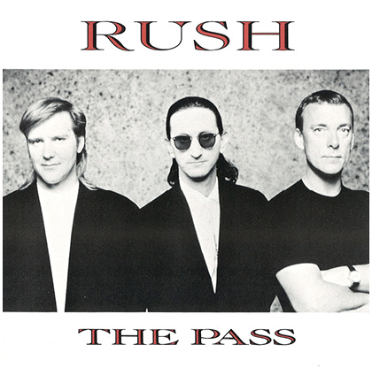 The sleeve for the single 'The Pass.' It features a black and white group portrait of the band. From left to right, Alex, Geddy, and Neil.