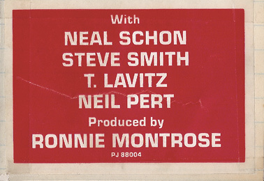 A red and white sticker with Neil's name on it, but instead of his last name being spelled P-E-A-R-T, it's spelled P-E-R-T.