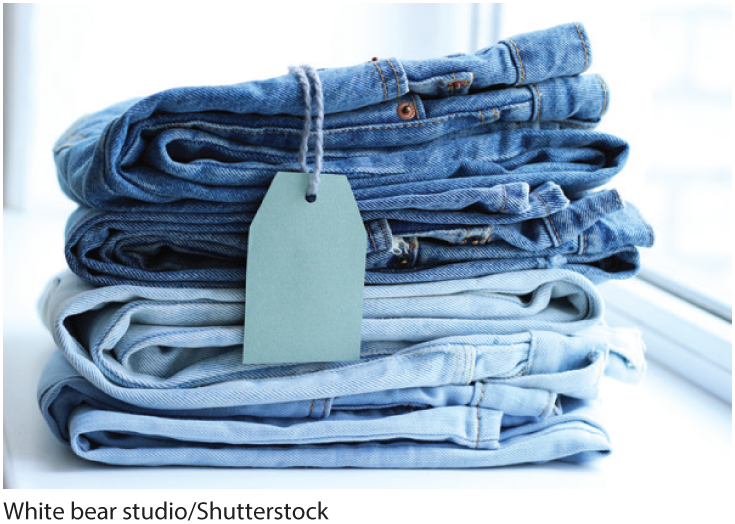 A photo shows two pairs of jeans with a price tag attached to one of them. 