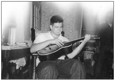 an incipient juvenile delinquent with guitar.