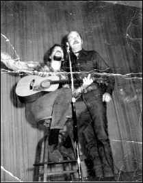 Dick Weissman, unknown, and John Gibbon with guitar